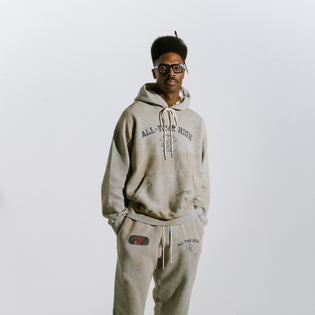  Mark in studio wearing Aim High heather grey cotton fleece hoodie and sweatpants with old school PE class graphics