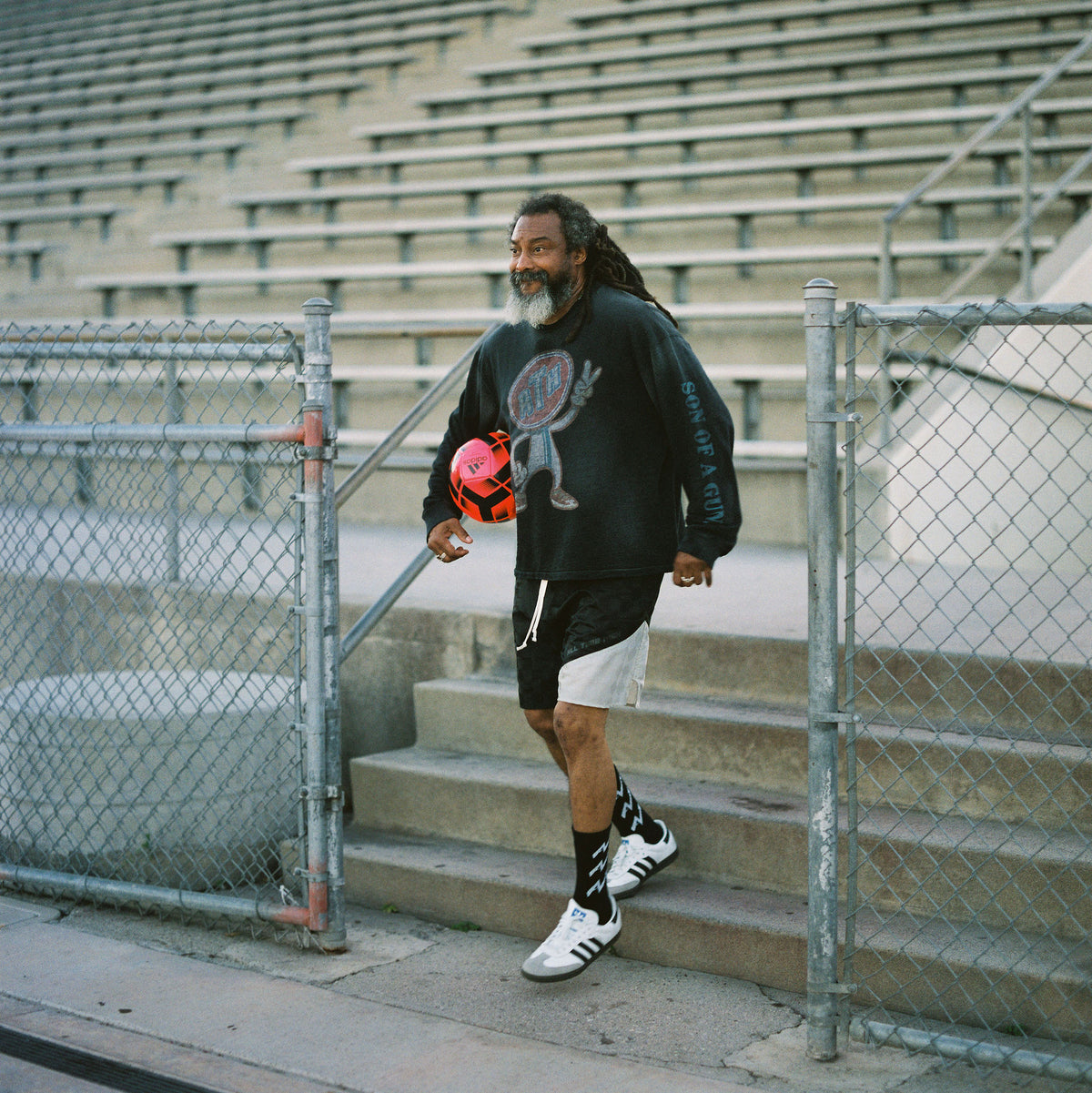Wil stepping on to the field wearing ATH checkerboard football shorts logo slub knit long sleeve and adidas sambas