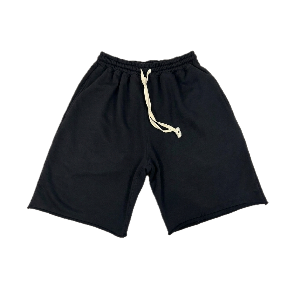 Black athletic shorts with an elastic waistband and a cream-colored drawstring, shown flat on a white background.